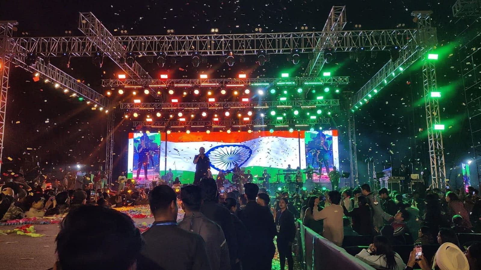 Festival stage with LED wall showing the national flag